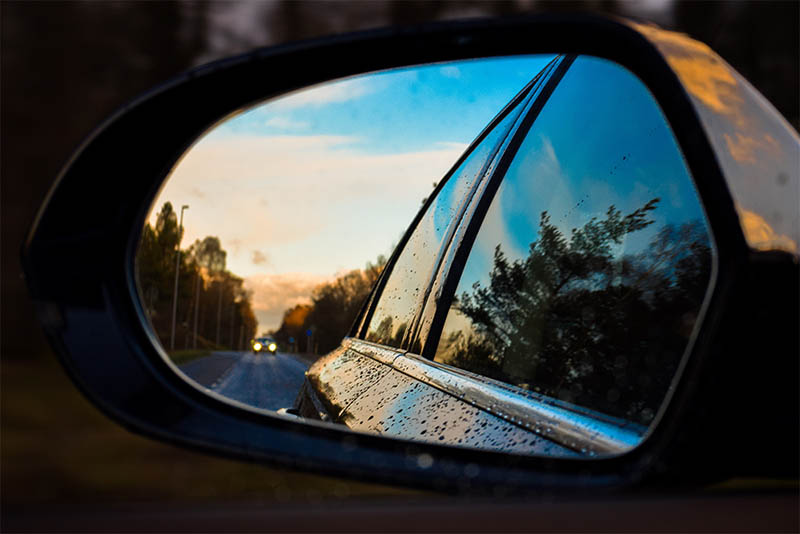 police car in rearview mirror but is it a real policeman